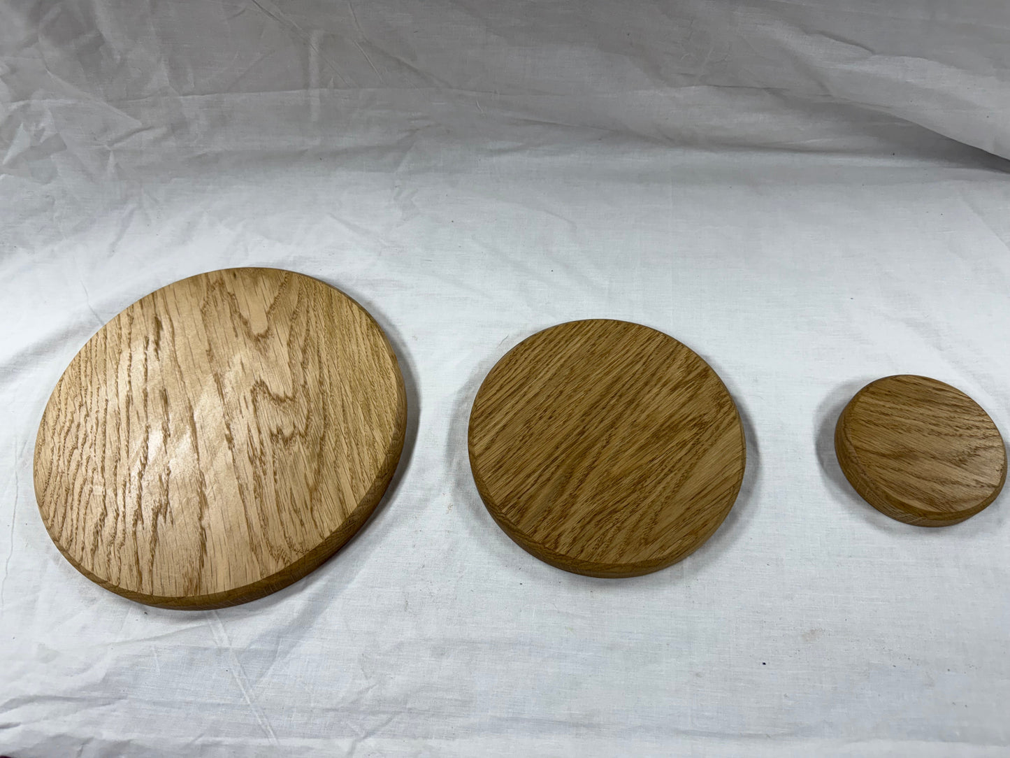 Circular solid oak plinths/plaques