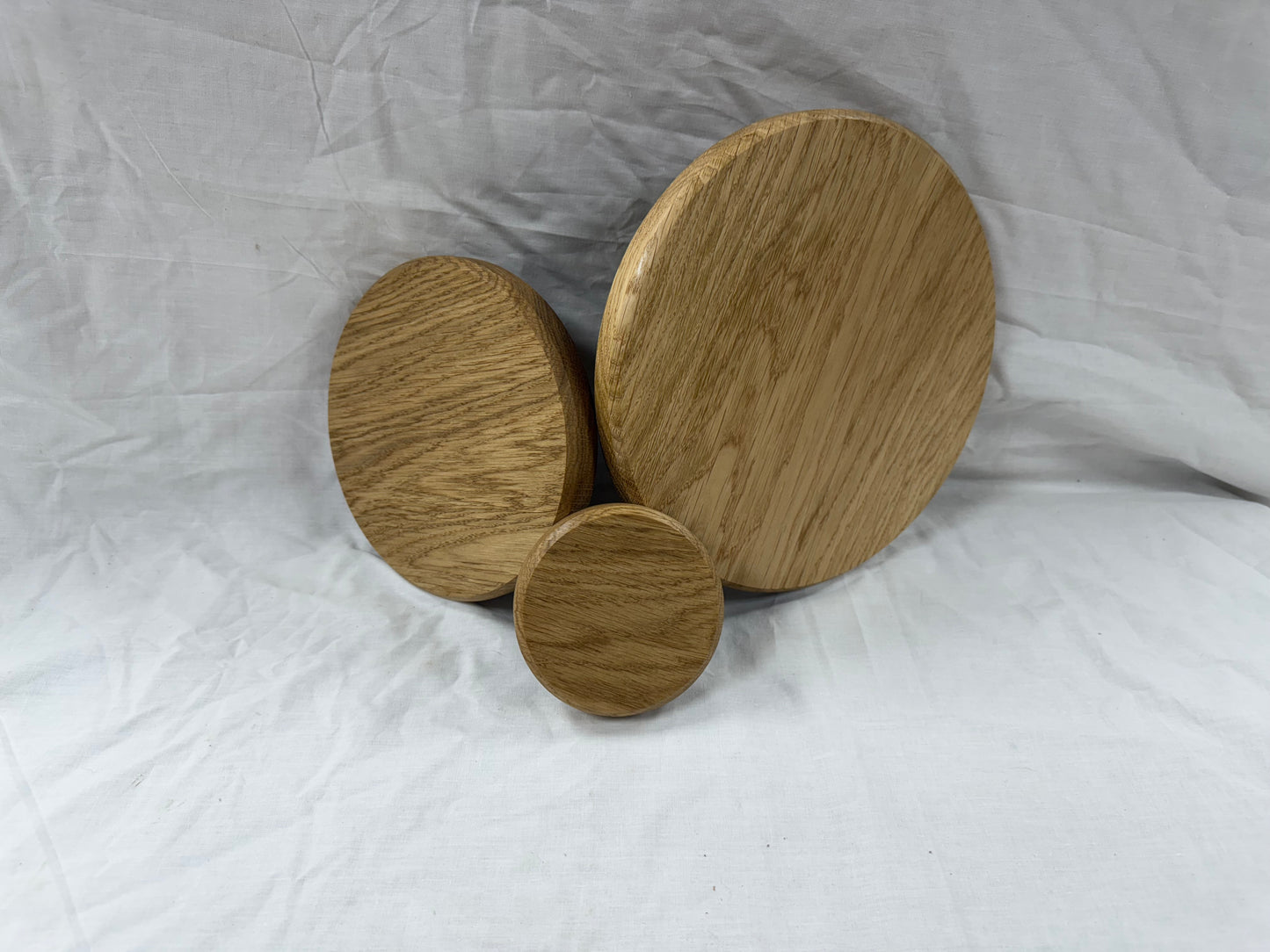 Circular solid oak plinths/plaques